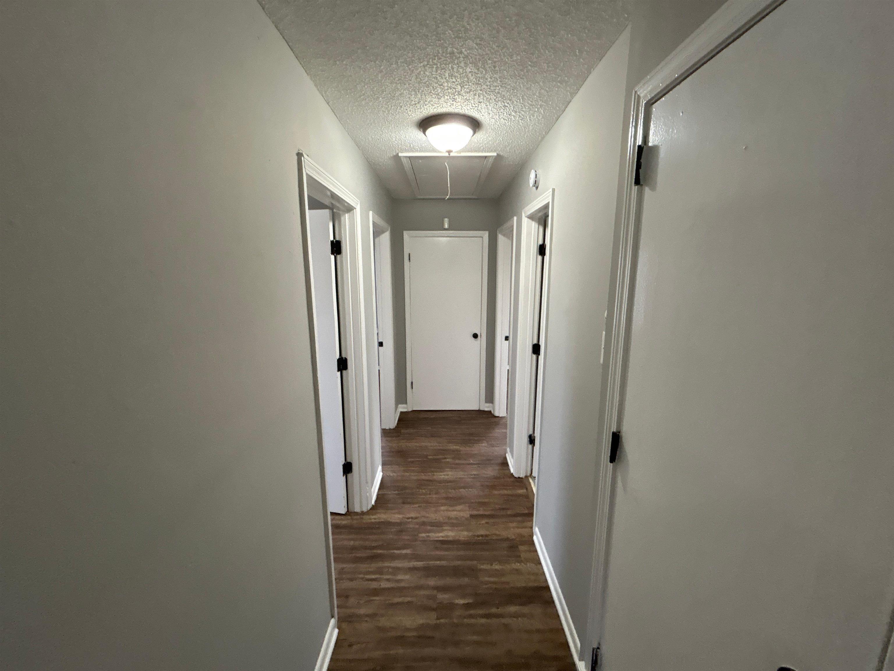 3509 Brantley Road Memphis, TN 38109 - Photo 5 of 9 a view of a hallway with wooden floor and closet area