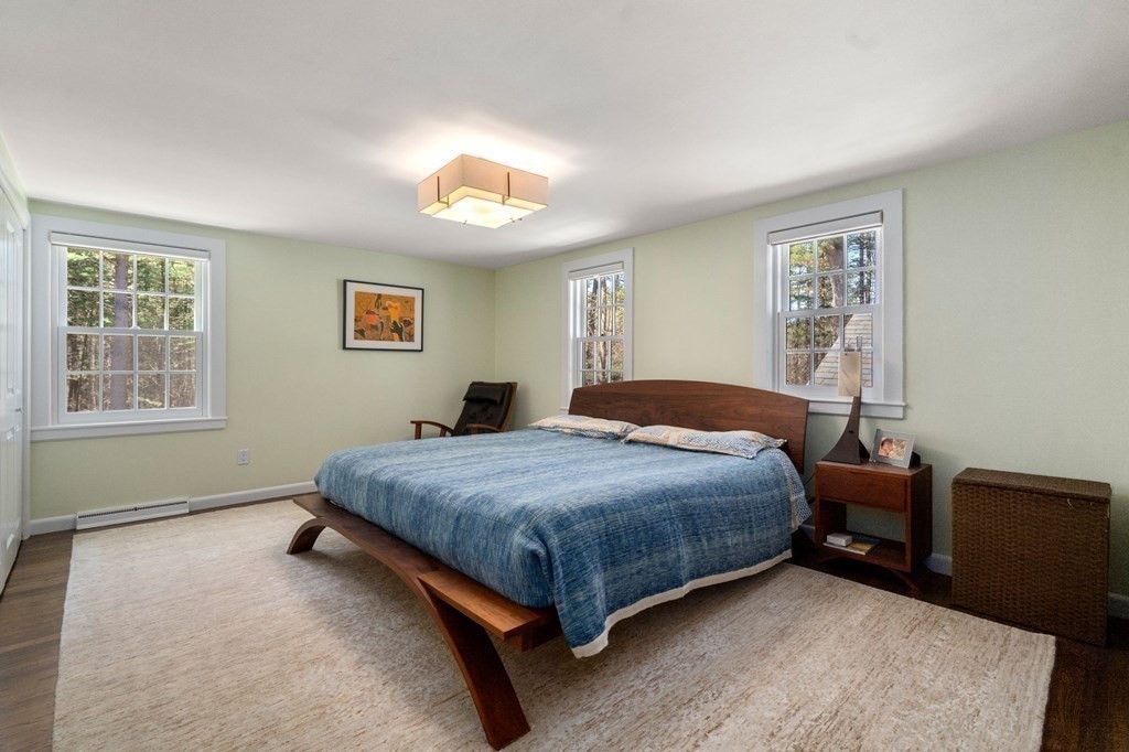 86 Concord Road Weston, MA 02493 - Photo 15 of 24 a bedroom with a bed and a window