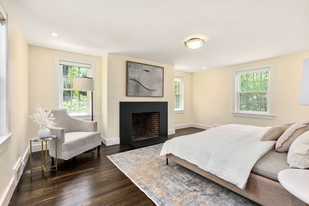 86 Concord Road Weston, MA 02493 - Photo 16 of 24 a living room with furniture and a fireplace