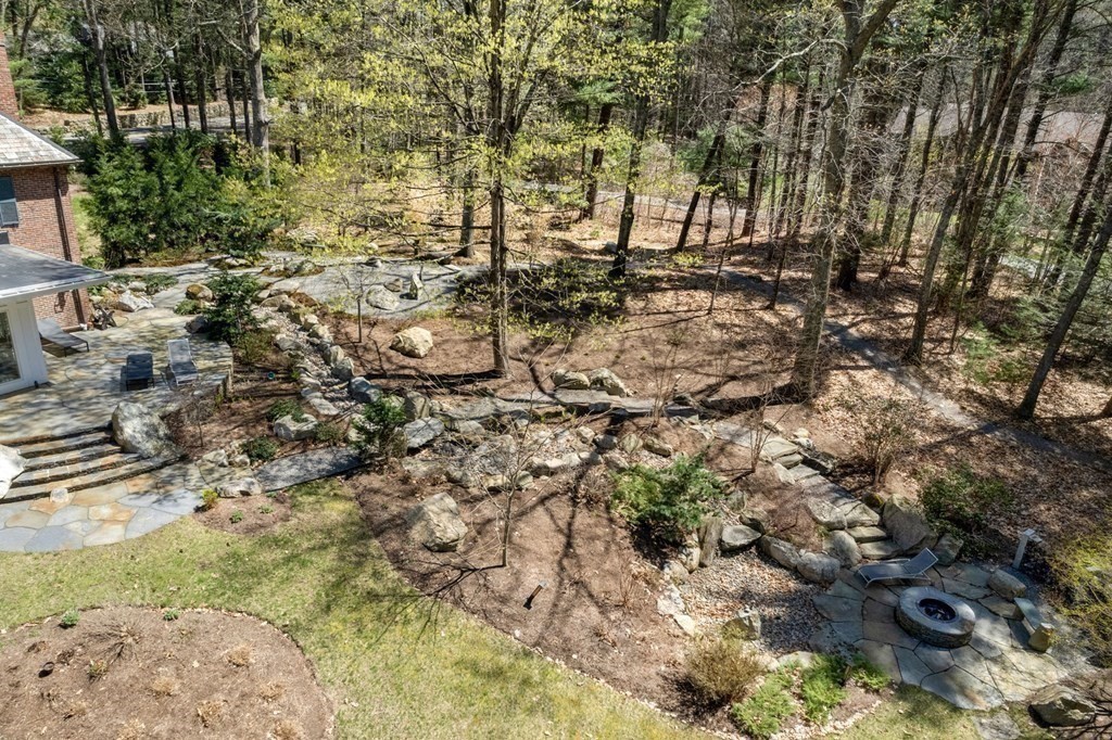 86 Concord Road Weston, MA 02493 - Photo 22 of 24 a view of a yard with a tree
