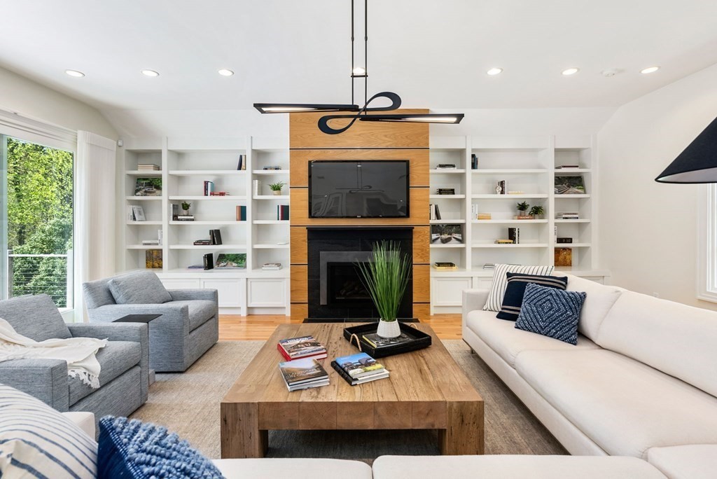 86 Concord Road Weston, MA 02493 - Photo 5 of 24 a living room with furniture and a fireplace