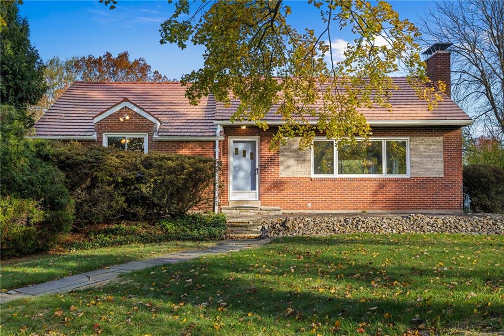 152 Easley Road Pittsburgh, PA 15237 - Photo 1 of 20 front view of a house with a garden
