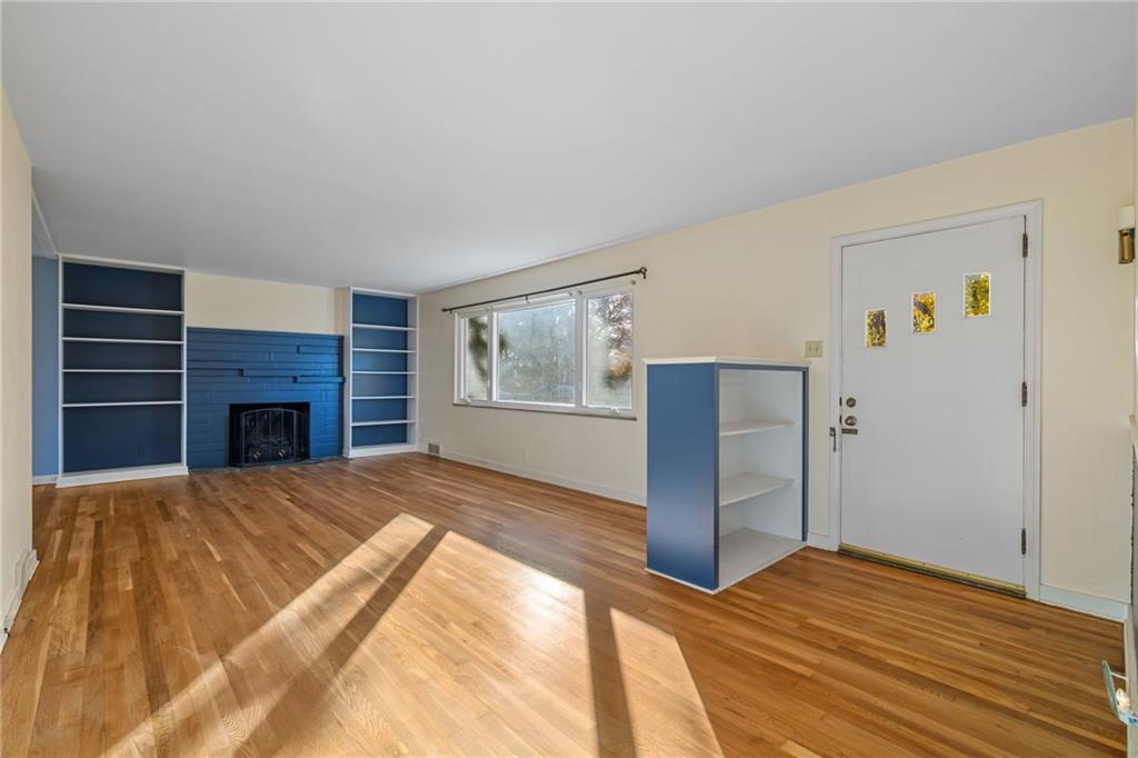 152 Easley Road Pittsburgh, PA 15237 - Photo 3 of 20 a bedroom with a bed and a fireplace