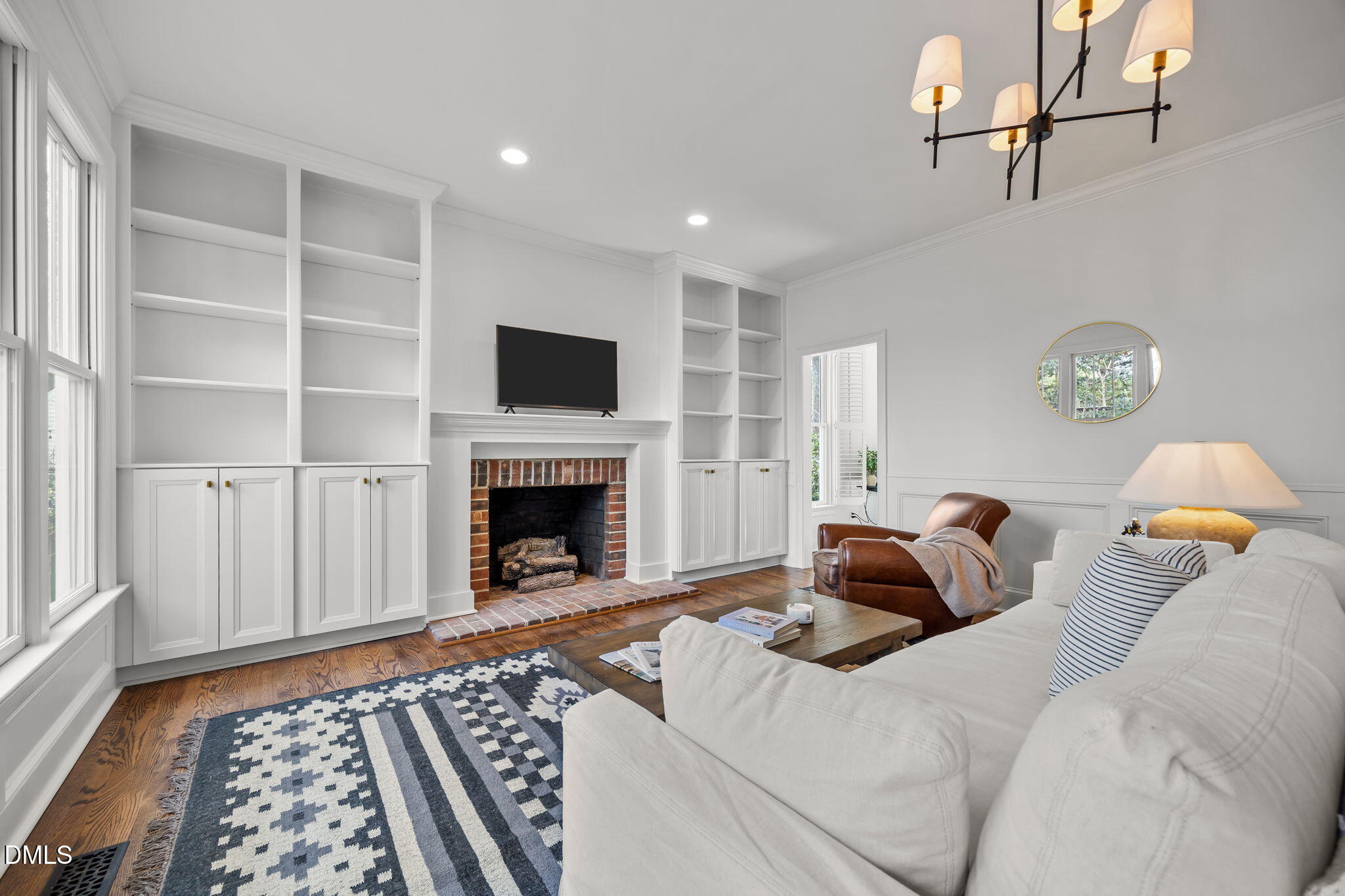 8805 Mourning Dove Road Raleigh, NC 27615 - Photo 11 of 55 a bedroom with a bed and a fireplace