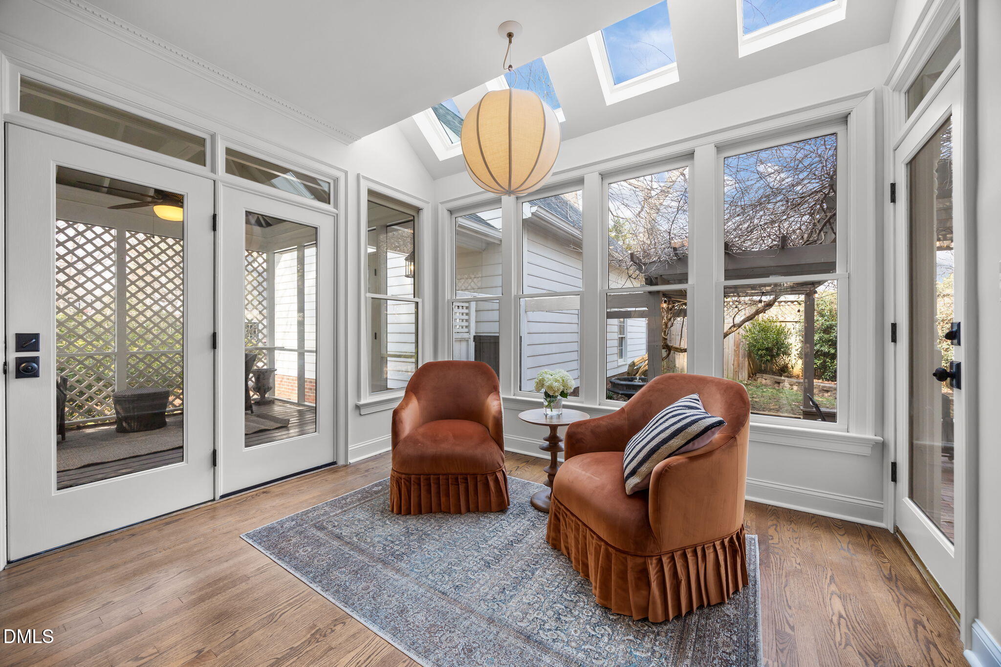 8805 Mourning Dove Road Raleigh, NC 27615 - Photo 13 of 55 a living room with furniture a floor to ceiling window and wooden floor