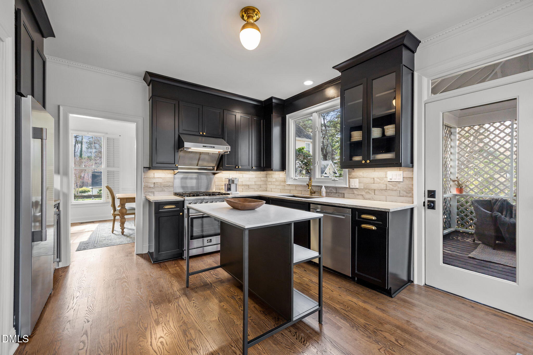 8805 Mourning Dove Road Raleigh, NC 27615 - Photo 18 of 55 a kitchen with a sink appliances and cabinets