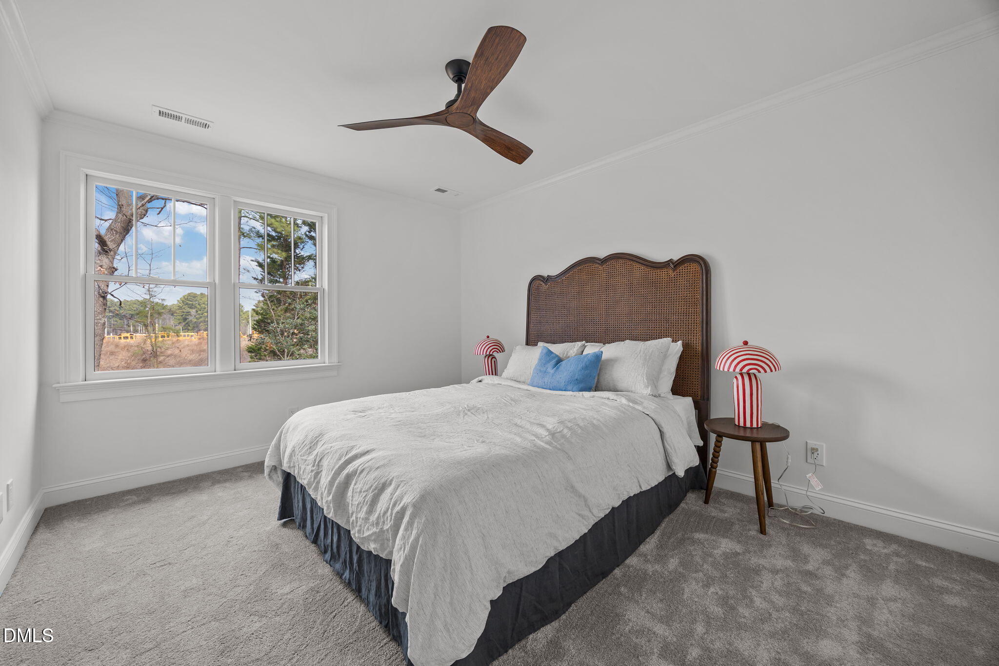 8805 Mourning Dove Road Raleigh, NC 27615 - Photo 22 of 55 a bedroom with a bed painting and window