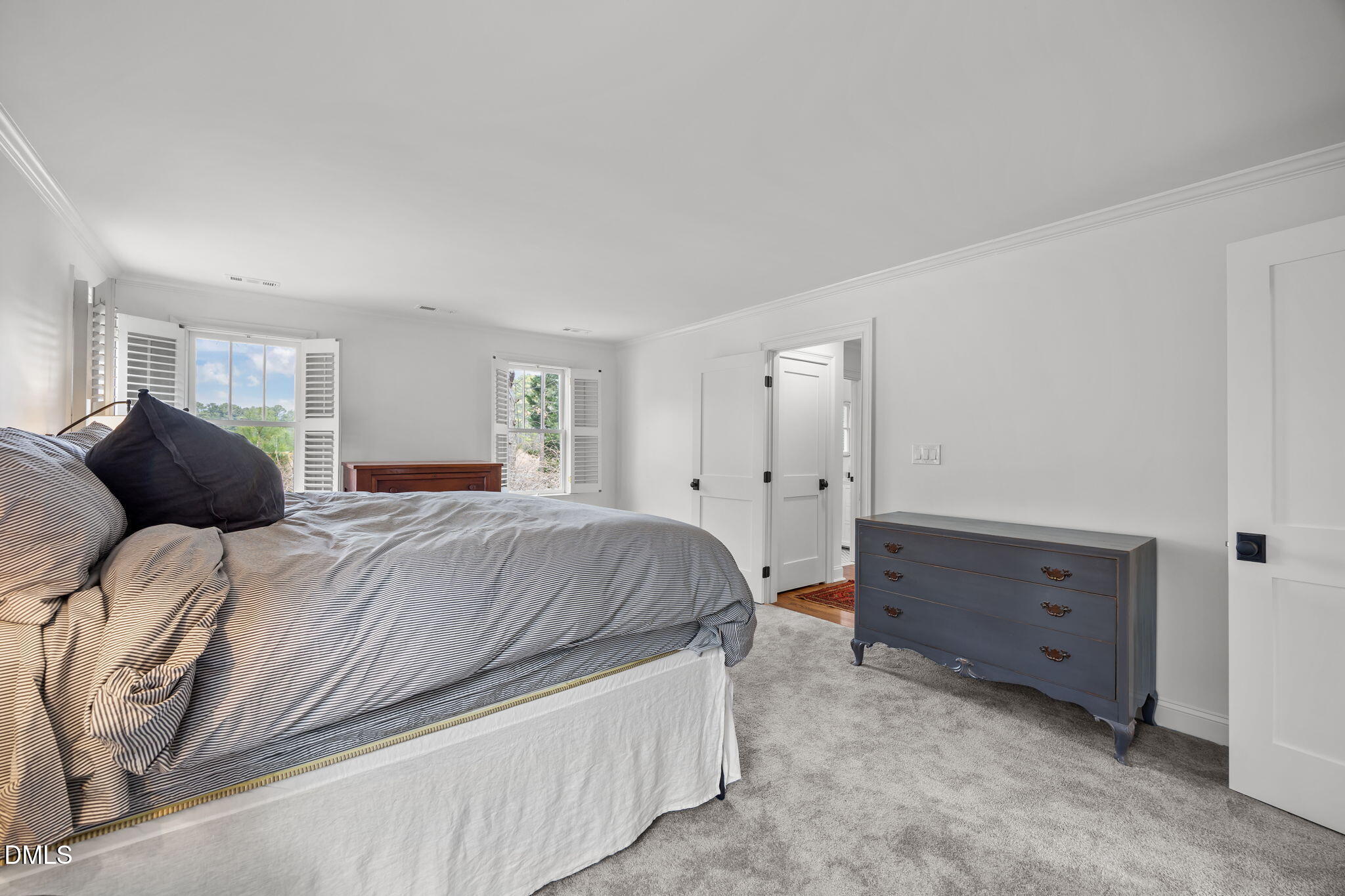 8805 Mourning Dove Road Raleigh, NC 27615 - Photo 28 of 55 a bedroom with a bed and a dresser