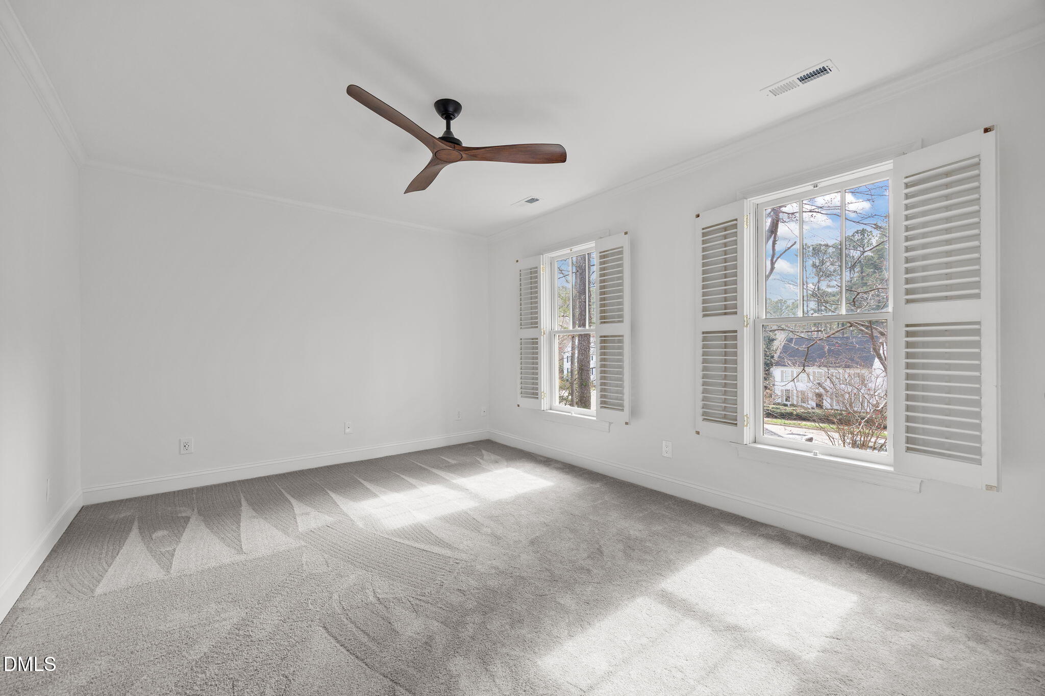 8805 Mourning Dove Road Raleigh, NC 27615 - Photo 30 of 55 a view of an empty room with a window