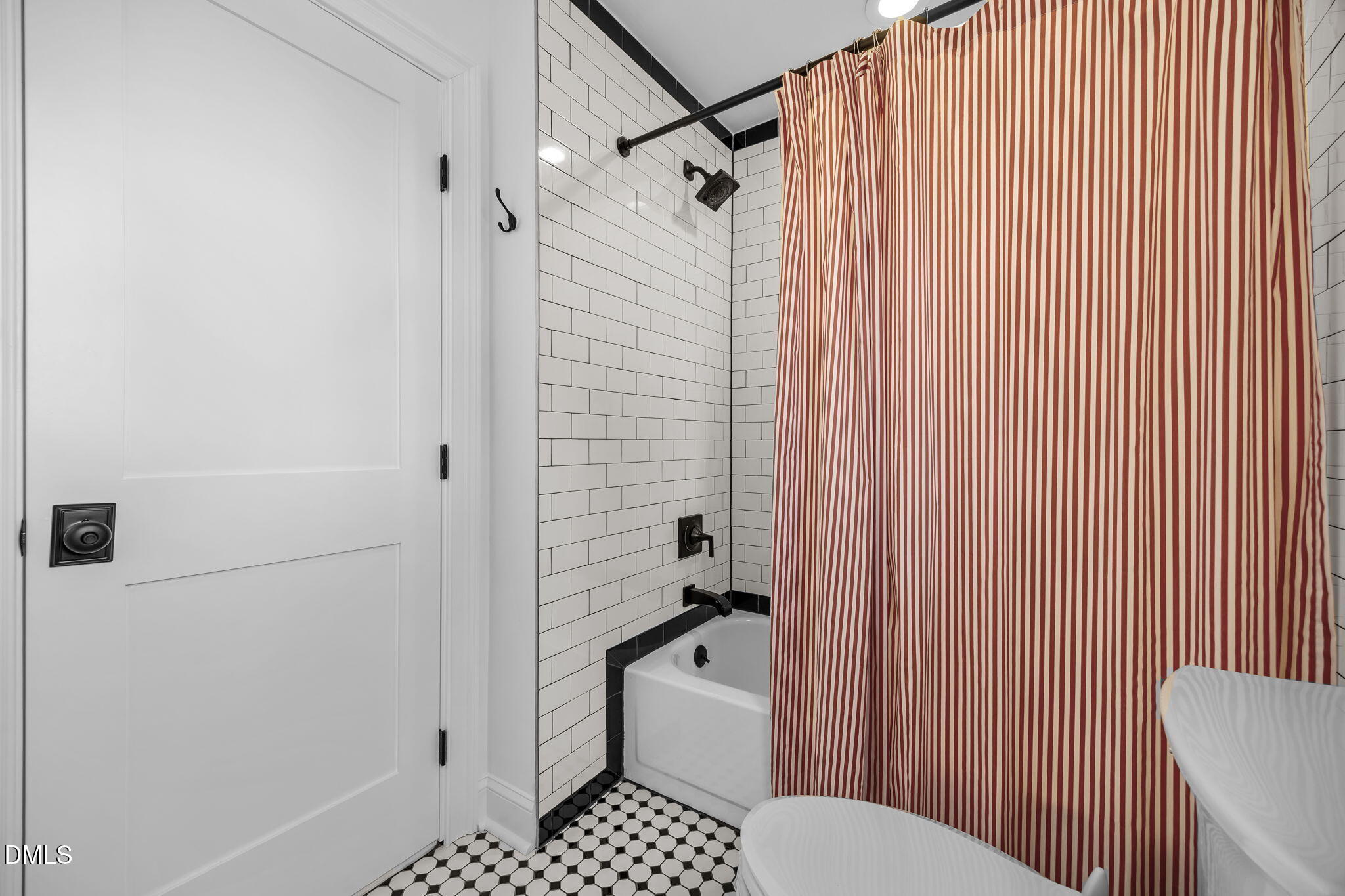 8805 Mourning Dove Road Raleigh, NC 27615 - Photo 31 of 55 a bathroom with a toilet and a shower