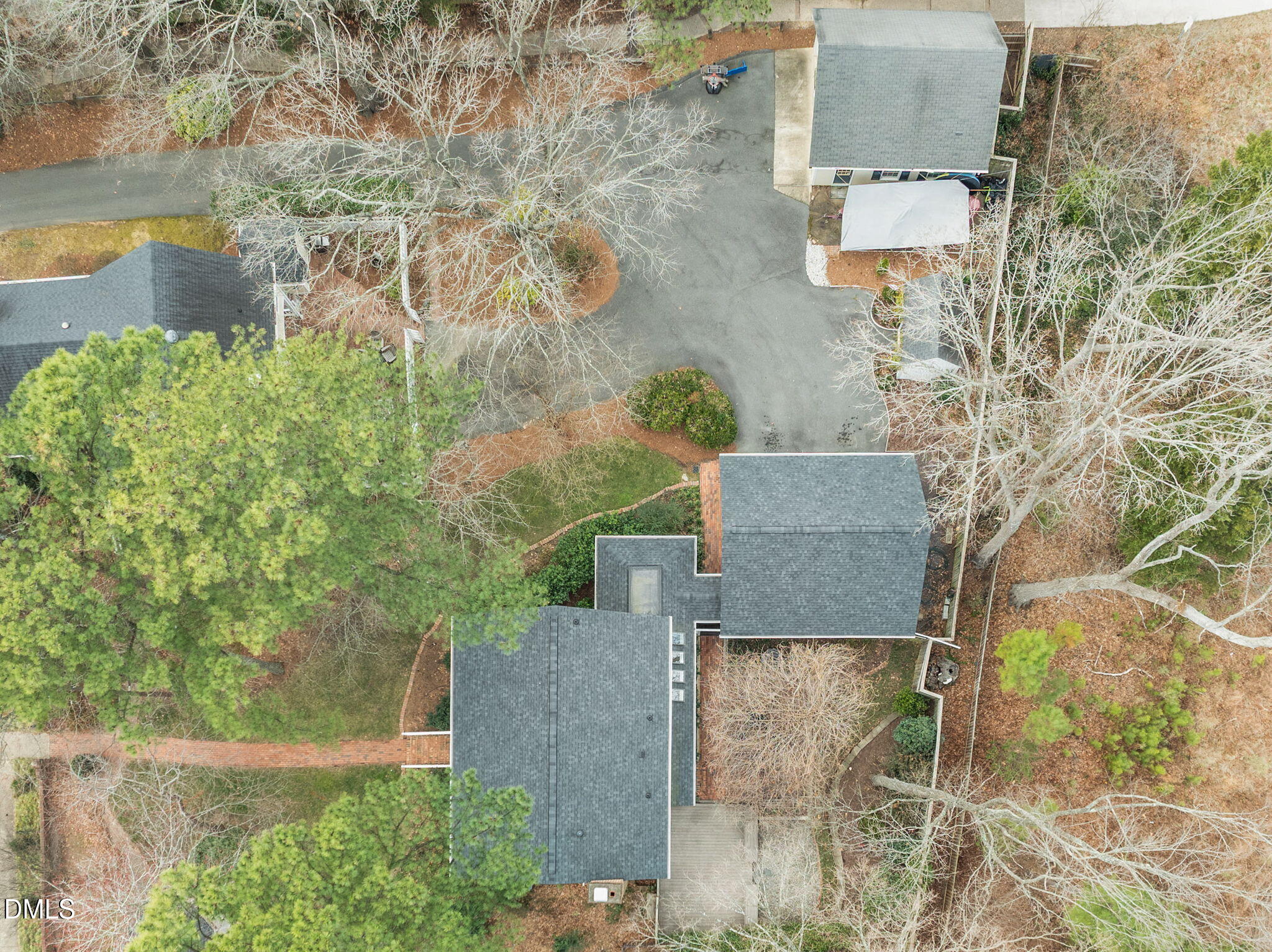 8805 Mourning Dove Road Raleigh, NC 27615 - Photo 47 of 55 an aerial view of a house with a yard and large trees