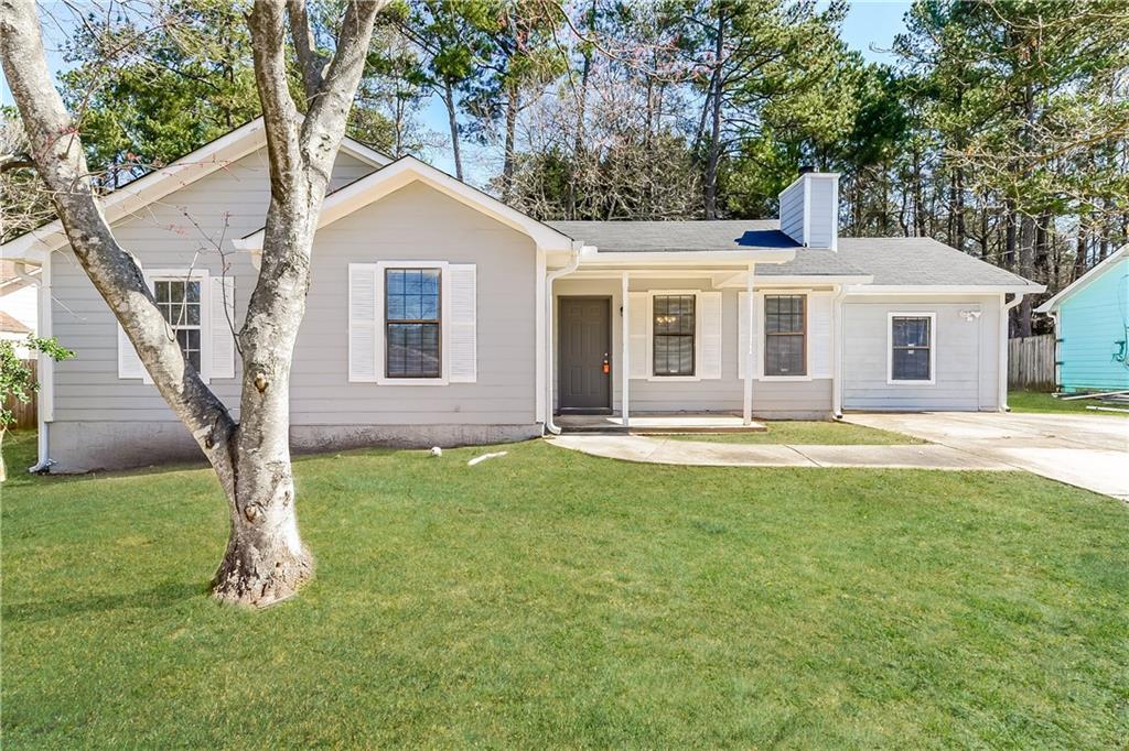10422 Candlelight Road Jonesboro, GA 30238 - Photo 1 of 1 a front view of house with yard and green space
