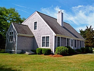 138 Mashnee Road Bourne, MA 02532 - Photo 13 of 15 a front view of a house with a yard