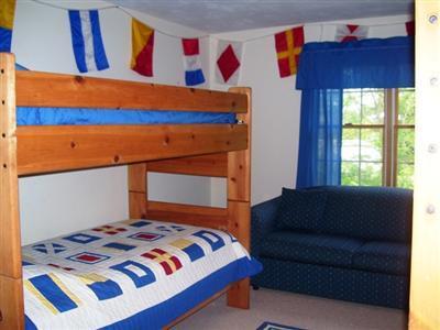 138 Mashnee Road Bourne, MA 02532 - Photo 7 of 15 a bedroom with a bed and a painting on the wall