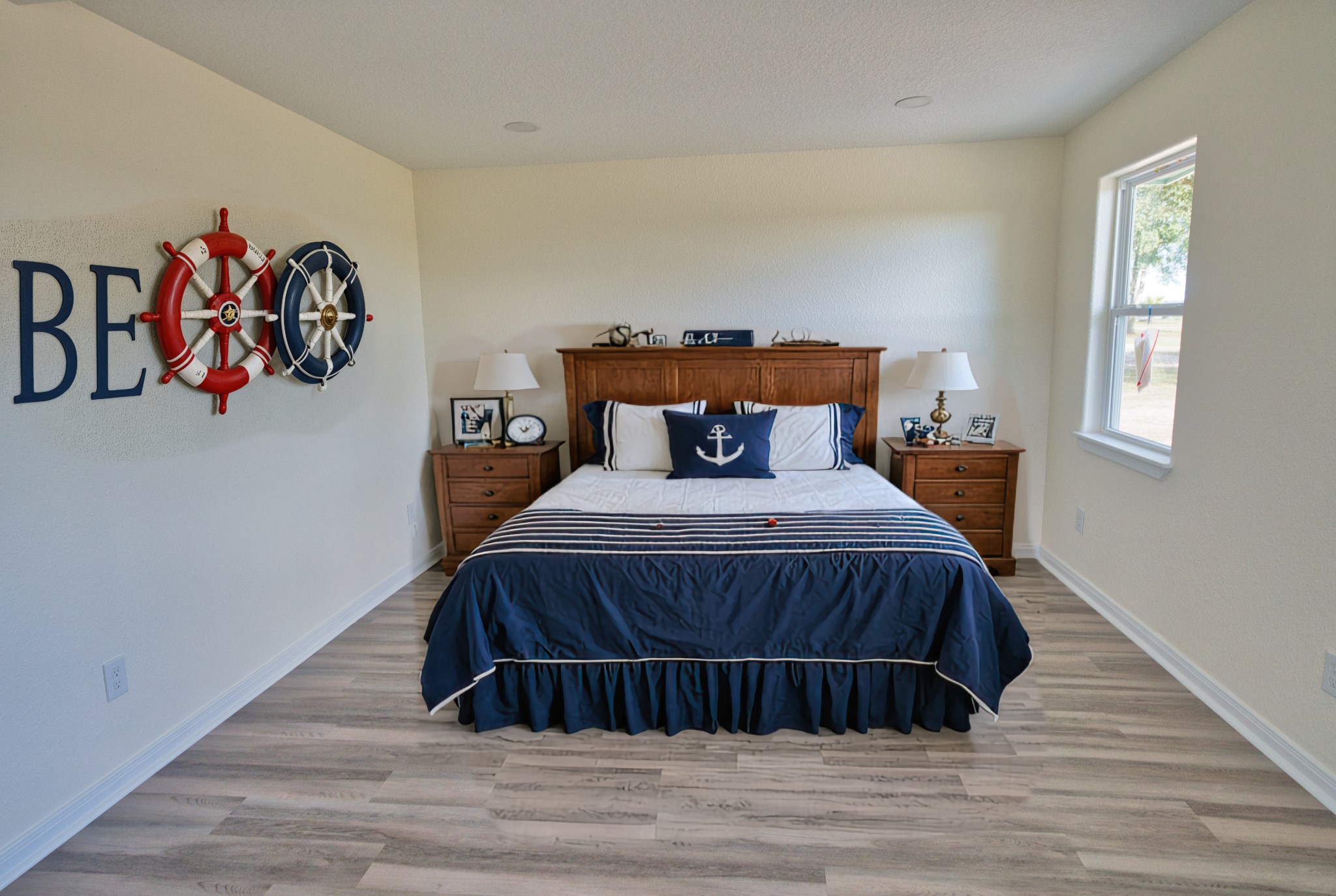 133 County Road 296 Sargent, TX 77414 - Photo 11 of 19 a bed sitting in a bedroom next to a window