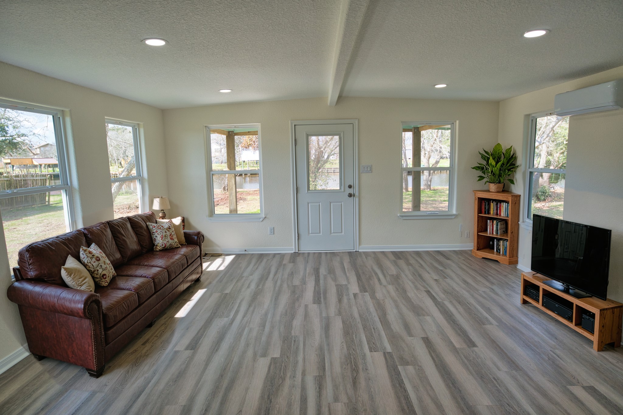133 County Road 296 Sargent, TX 77414 - Photo 4 of 19 a living room with furniture and a flat screen tv
