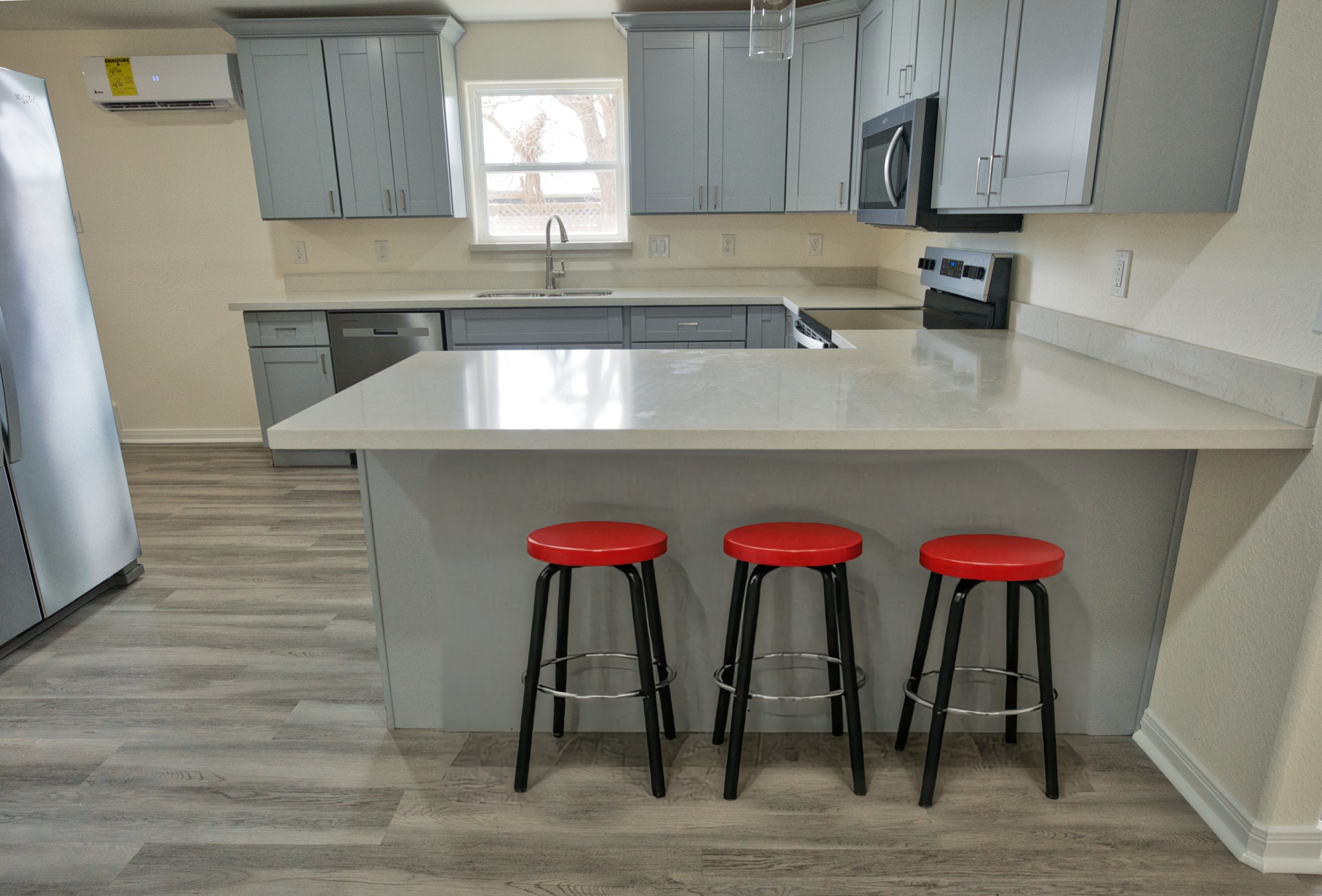 133 County Road 296 Sargent, TX 77414 - Photo 6 of 19 a kitchen with stainless steel appliances granite countertop a table chairs in it and wooden floors