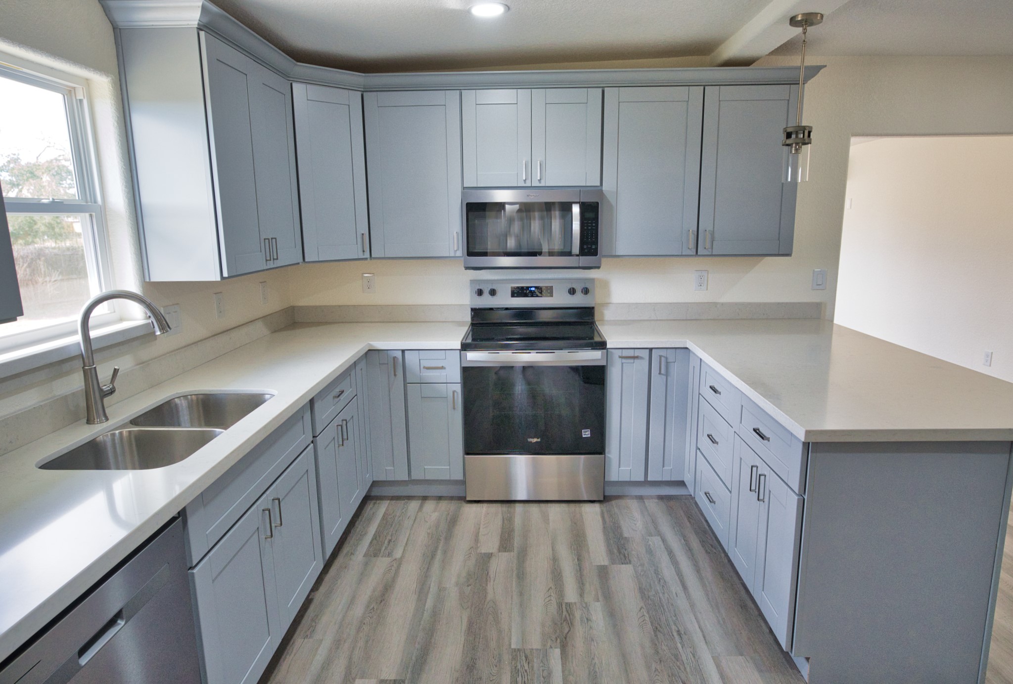 133 County Road 296 Sargent, TX 77414 - Photo 7 of 19 a kitchen with granite countertop a sink a counter space stainless steel appliances and cabinets