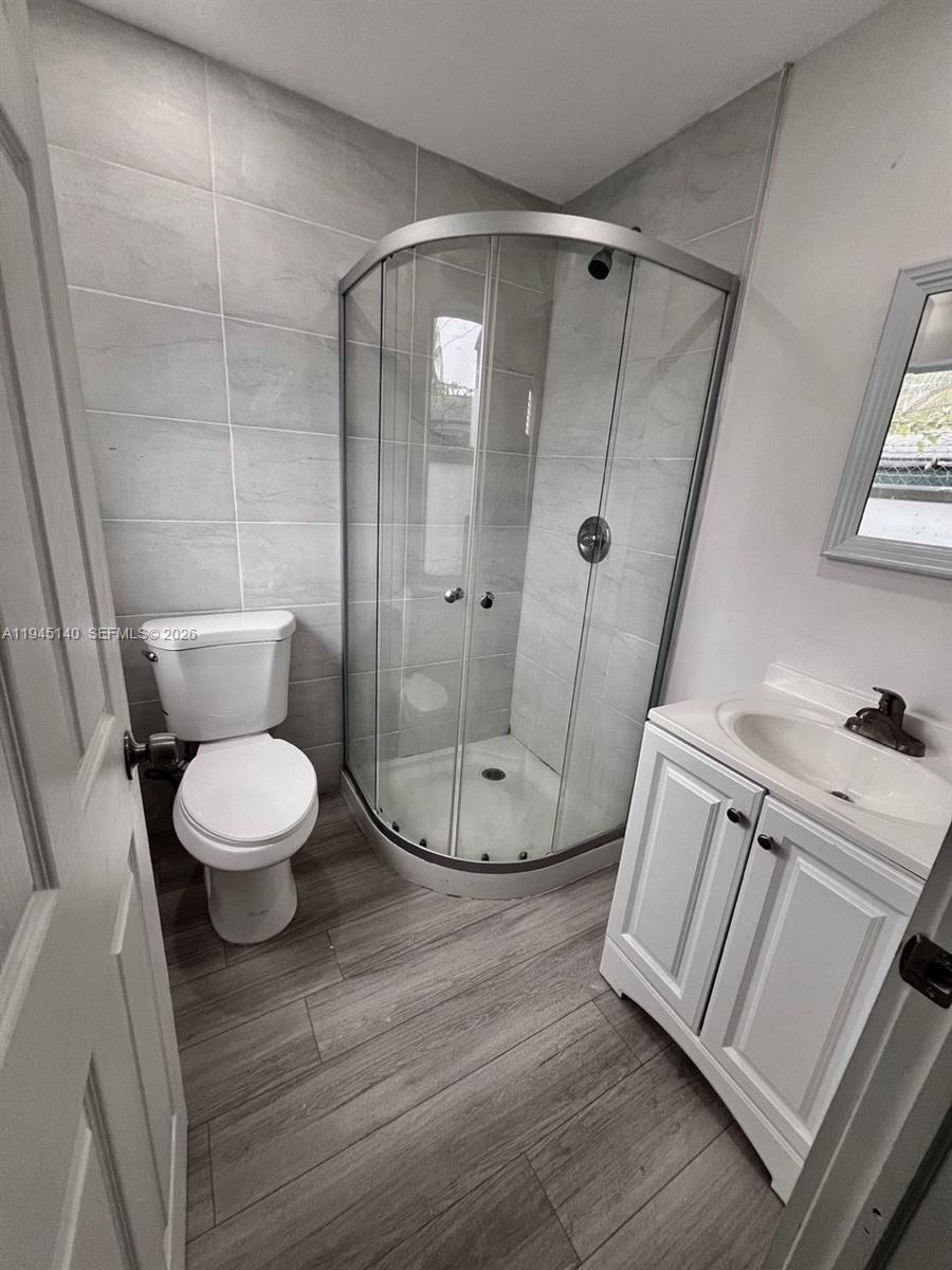 852 Southwest 13th Avenue, Unit 3 Miami, FL 33135 - Photo 14 of 20 a bathroom with a toilet and a shower