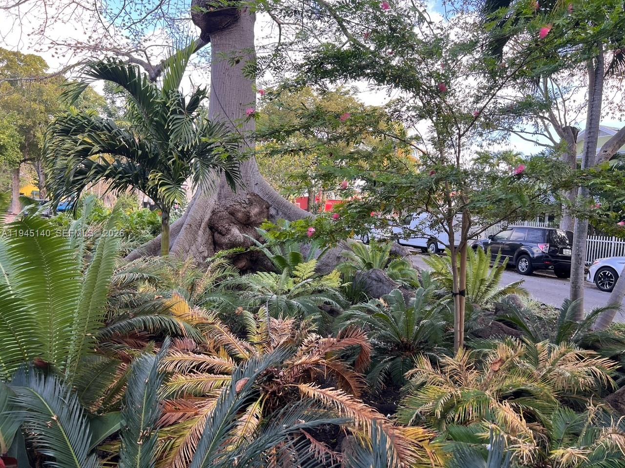 852 Southwest 13th Avenue, Unit 3 Miami, FL 33135 - Photo 20 of 20 a backyard of a house with lots of green space