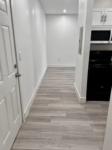 a white refrigerator freezer sitting inside of a kitchen
