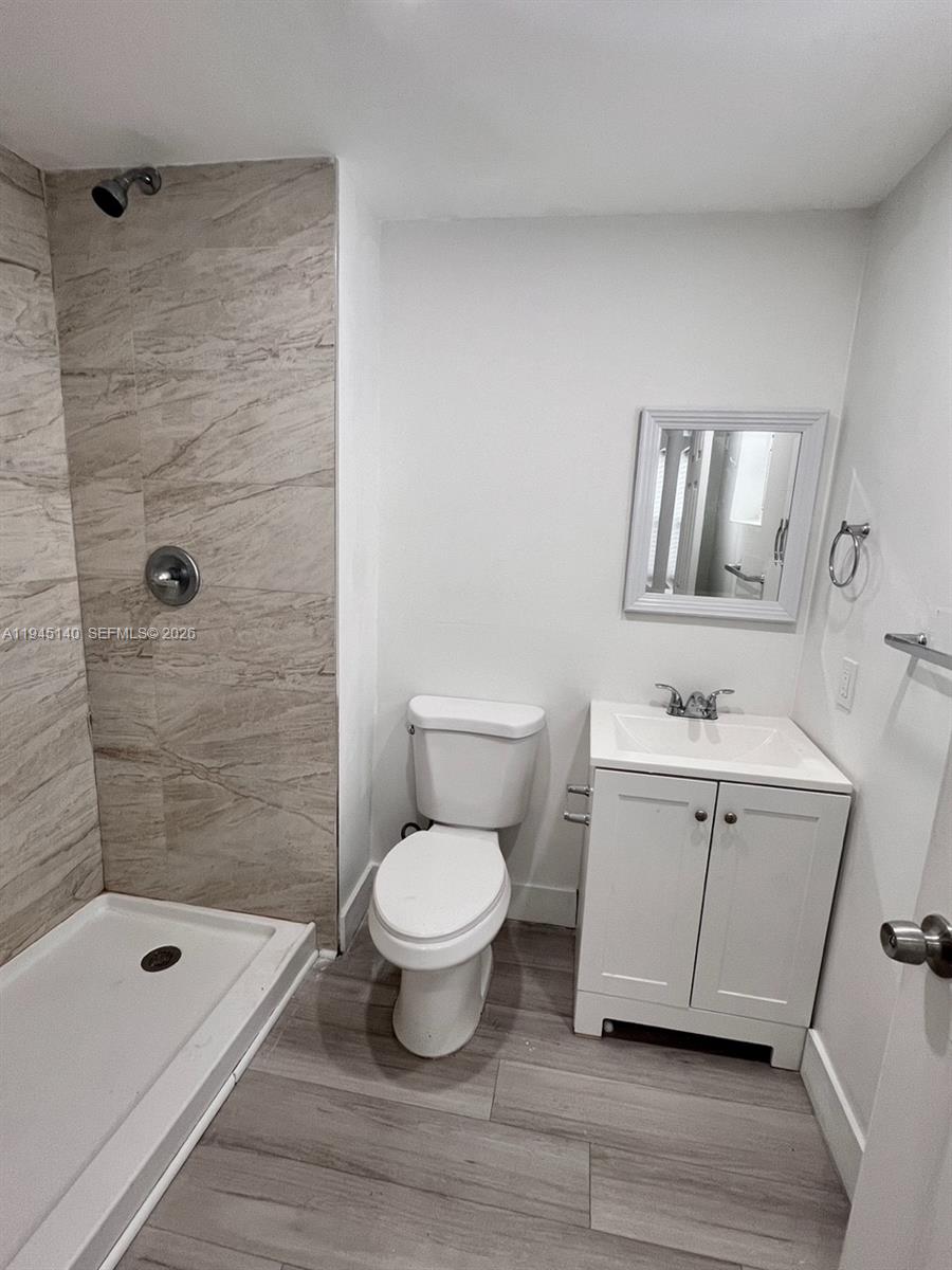852 Southwest 13th Avenue, Unit 3 Miami, FL 33135 - Photo 9 of 20 a bathroom with a sink toilet and shower