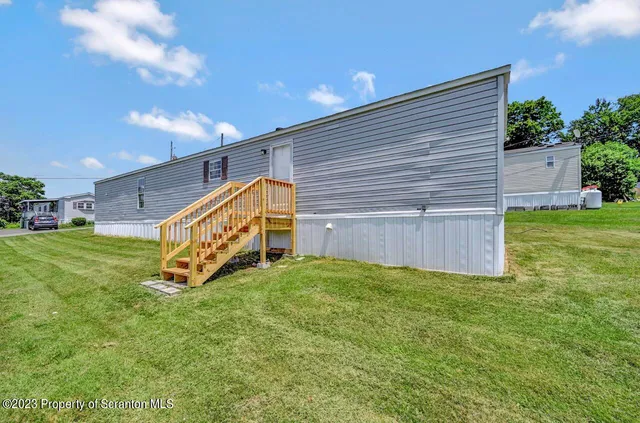 a view of a back yard of the house