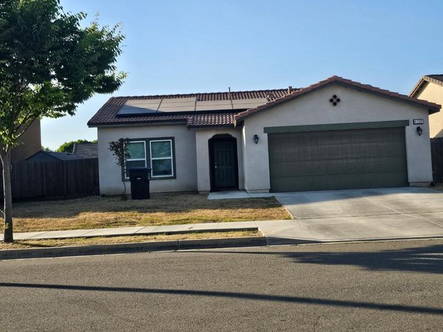 a front view of a house with a garage