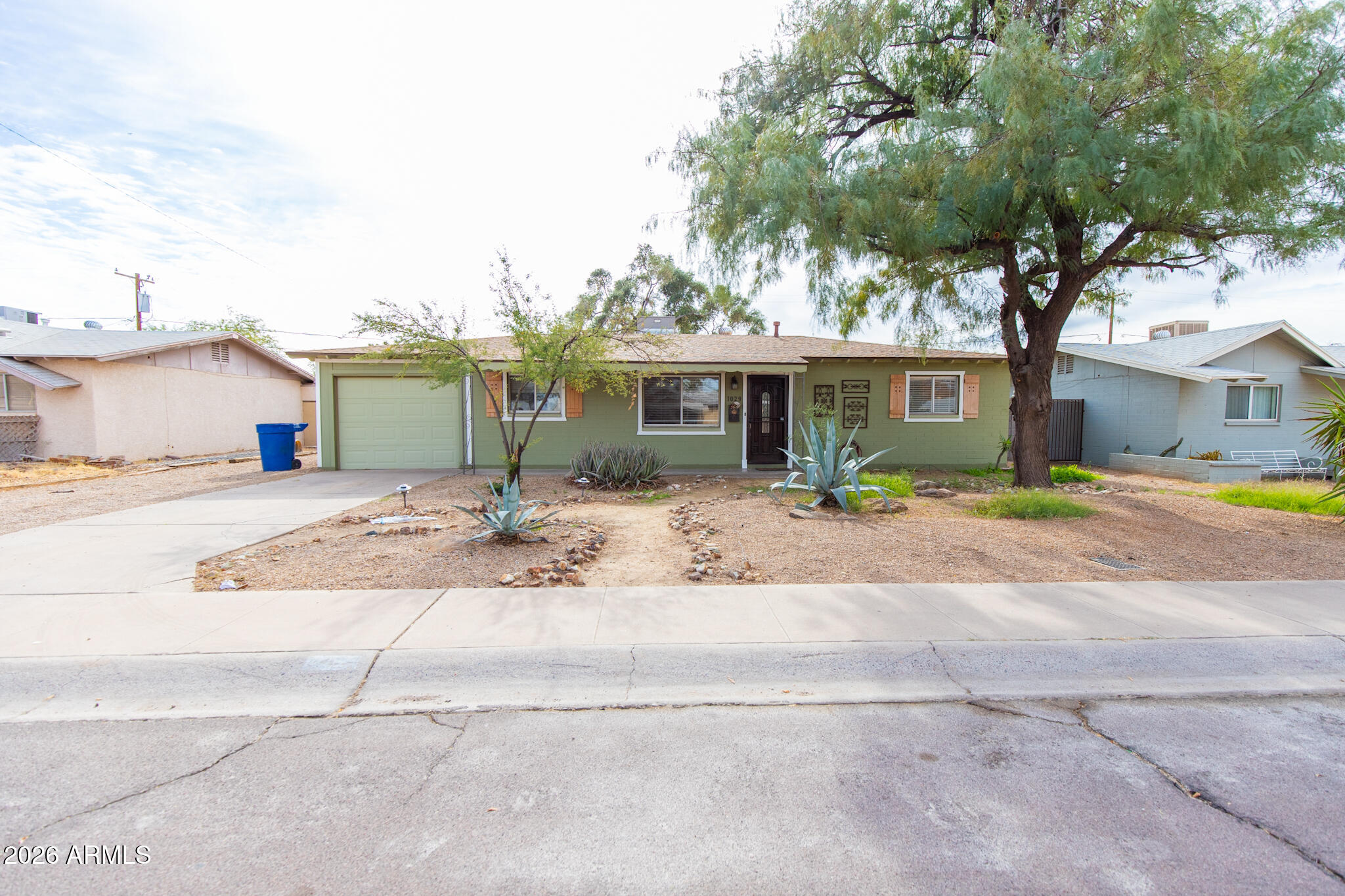 1029 West Elna Rae Street Tempe, AZ 85281 - Photo 1 of 20 front view of a house with a patio