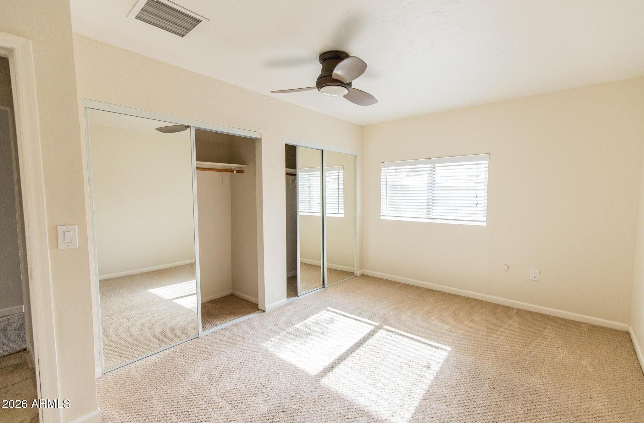 1029 West Elna Rae Street Tempe, AZ 85281 - Photo 12 of 20 a view of an empty room with a window