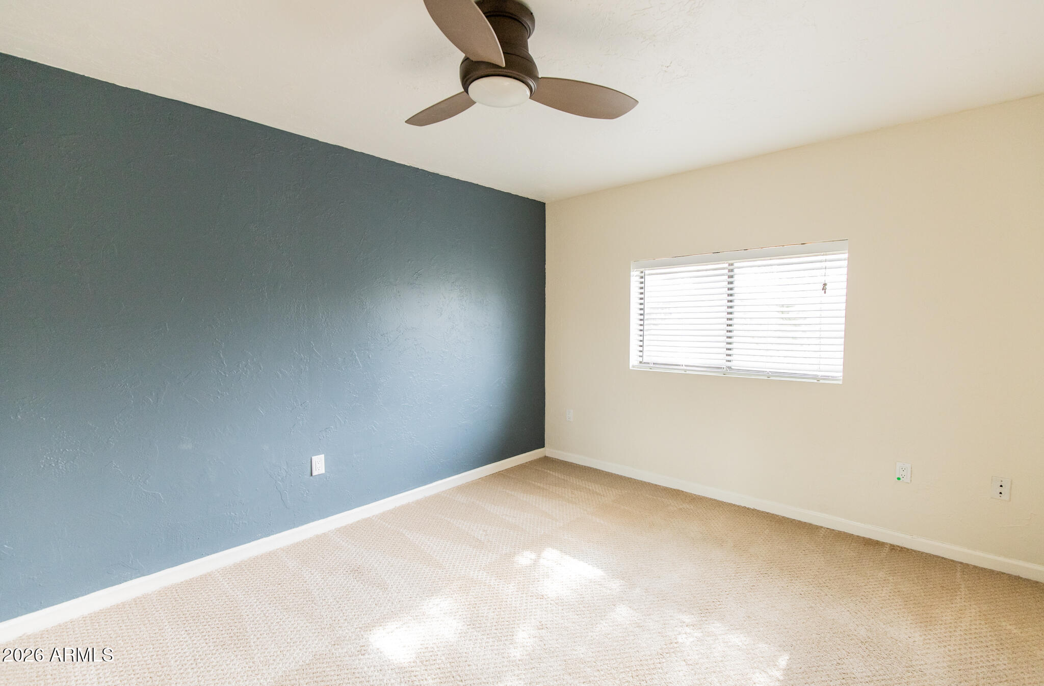 1029 West Elna Rae Street Tempe, AZ 85281 - Photo 15 of 20 a view of an empty room with a window