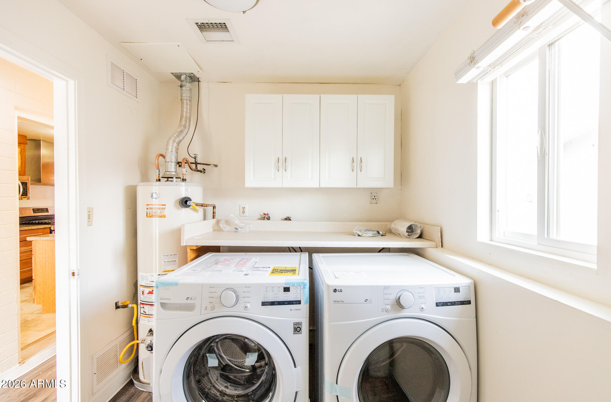 1029 West Elna Rae Street Tempe, AZ 85281 - Photo 18 of 20 a utility room with dryer and washer