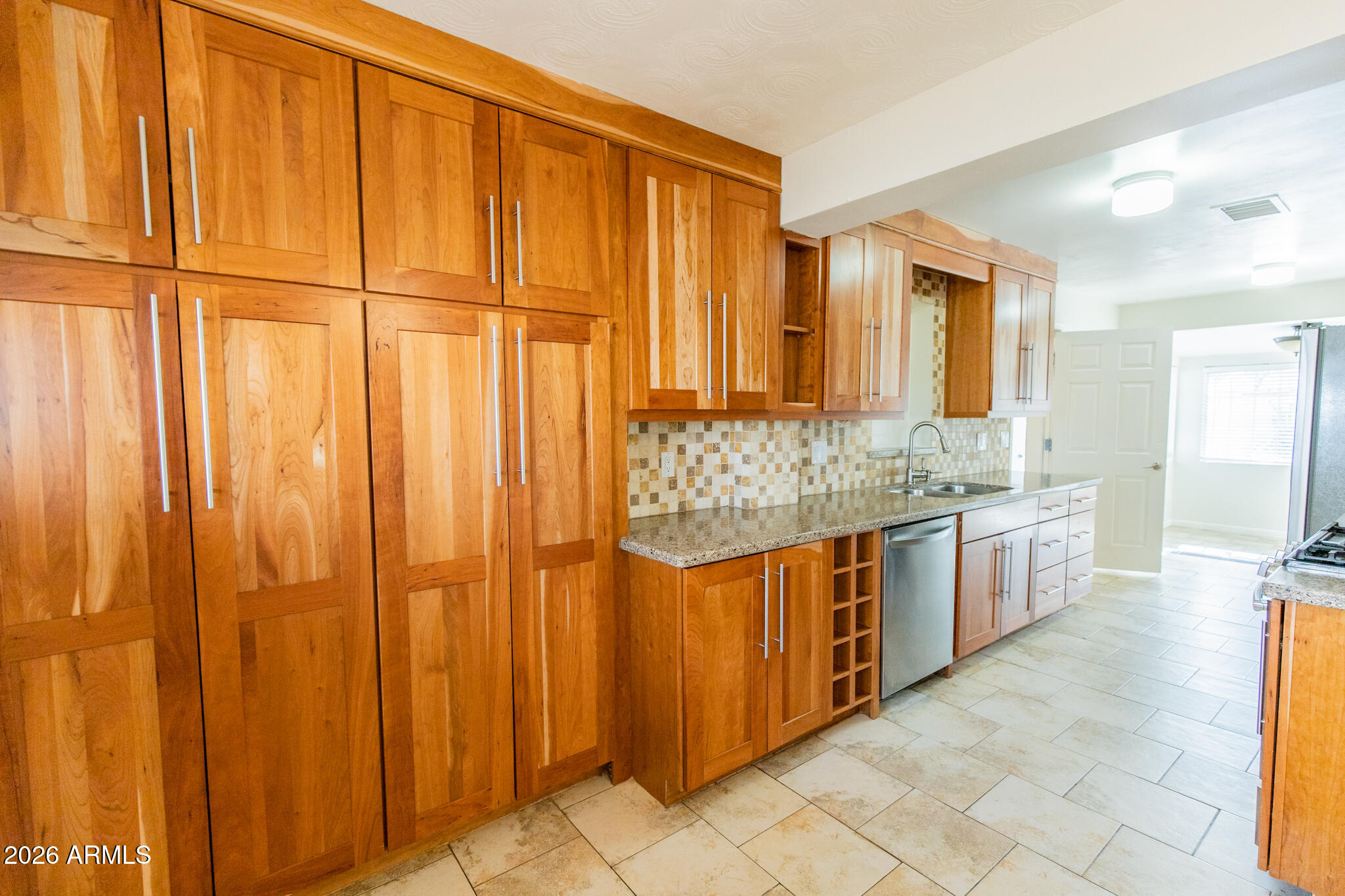 1029 West Elna Rae Street Tempe, AZ 85281 - Photo 4 of 20 a large bathroom with a granite countertop sink and a large mirror