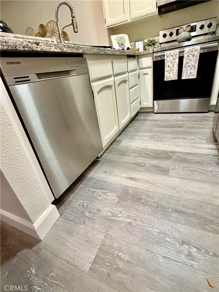 3400 Sullivan Court, Unit 105 Modesto, CA 95356 - Photo 16 of 46 a kitchen with a stove top oven and a sink