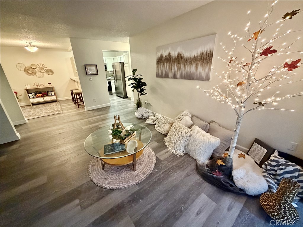 3400 Sullivan Court, Unit 105 Modesto, CA 95356 - Photo 18 of 46 a living room with furniture and a wooden floor