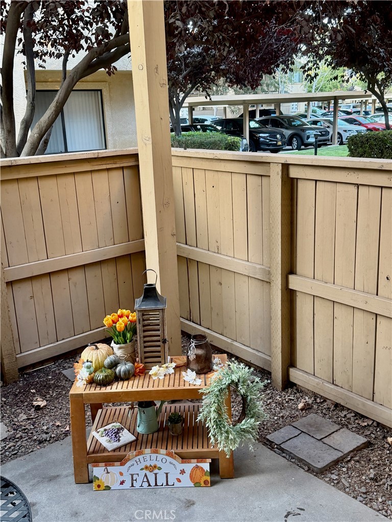 3400 Sullivan Court, Unit 105 Modesto, CA 95356 - Photo 22 of 46 a wooden bench sitting in front of a building