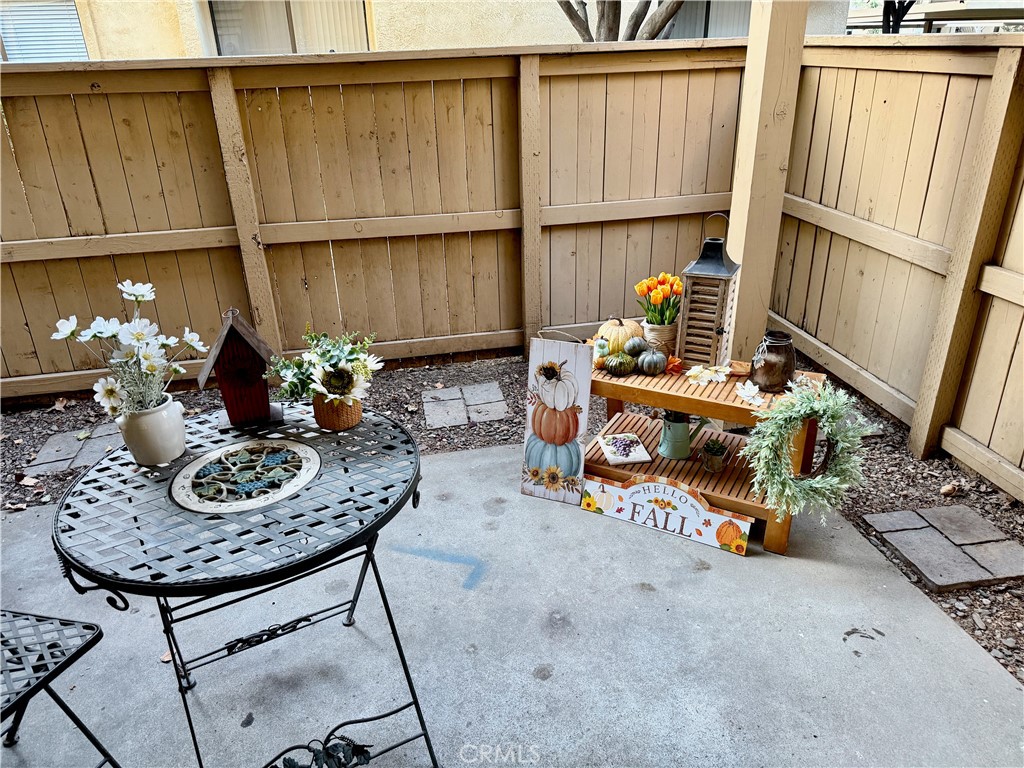 3400 Sullivan Court, Unit 105 Modesto, CA 95356 - Photo 24 of 46 a living room with furniture a rug and a window