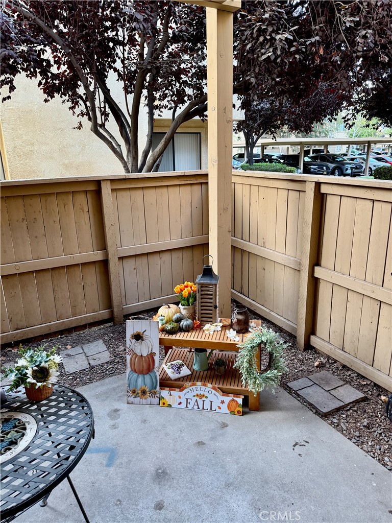 3400 Sullivan Court, Unit 105 Modesto, CA 95356 - Photo 25 of 46 a backyard of a house with barbeque oven table and chairs