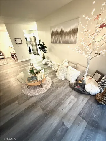 a view of living room with furniture and a potted plant