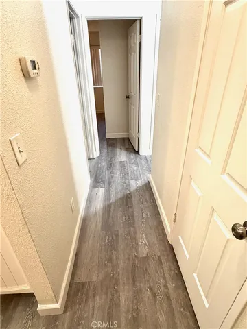 a view of a dining room with wooden floor