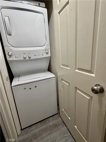 a view of a dining room with a table and chairs