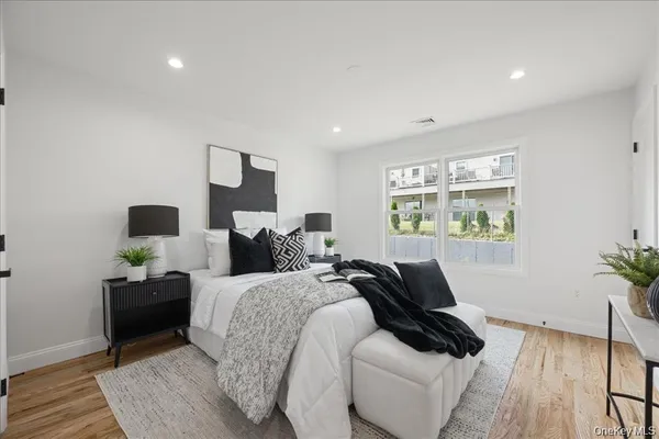 a bed room with bed and a window