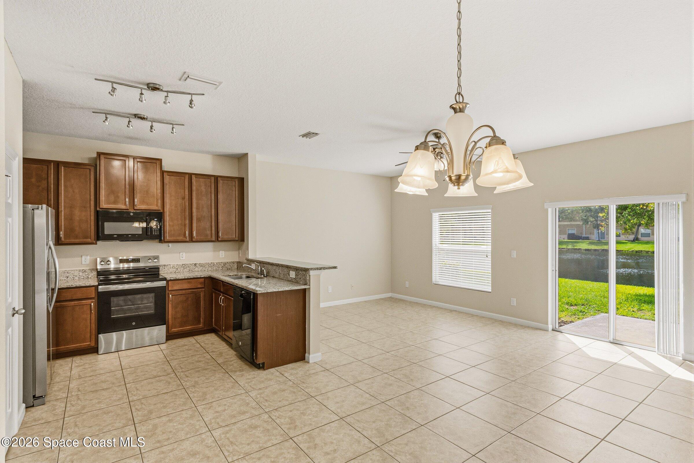 2780 Reston Street, Unit 105 Melbourne, FL 32935 - Photo 6 of 32 Open Area Living/Dining/Kitchen