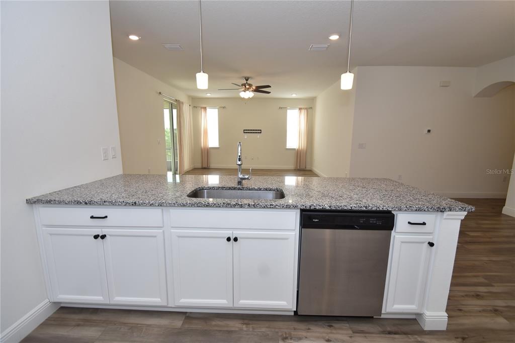 59 Oakleaf Way Palm Coast, FL 32137 - Photo 16 of 39 a bathroom with a granite countertop sink a large mirror and a shower