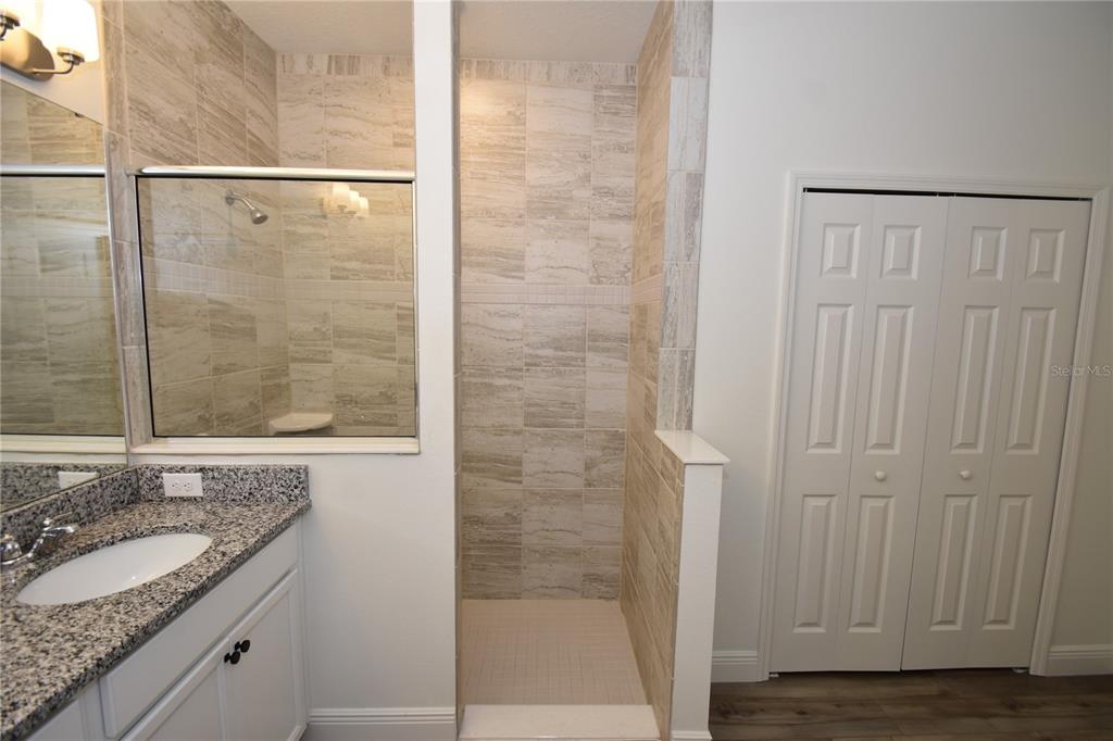 59 Oakleaf Way Palm Coast, FL 32137 - Photo 22 of 39 a bathroom with a granite countertop sink and a mirror