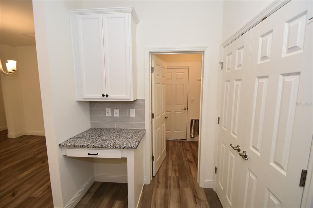 59 Oakleaf Way Palm Coast, FL 32137 - Photo 24 of 39 a kitchen with white cabinets and sink