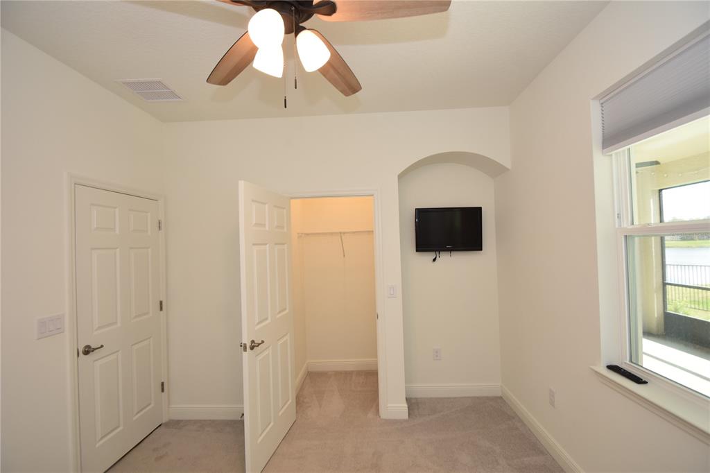 59 Oakleaf Way Palm Coast, FL 32137 - Photo 30 of 39 a view of a livingroom with a chandelier fan
