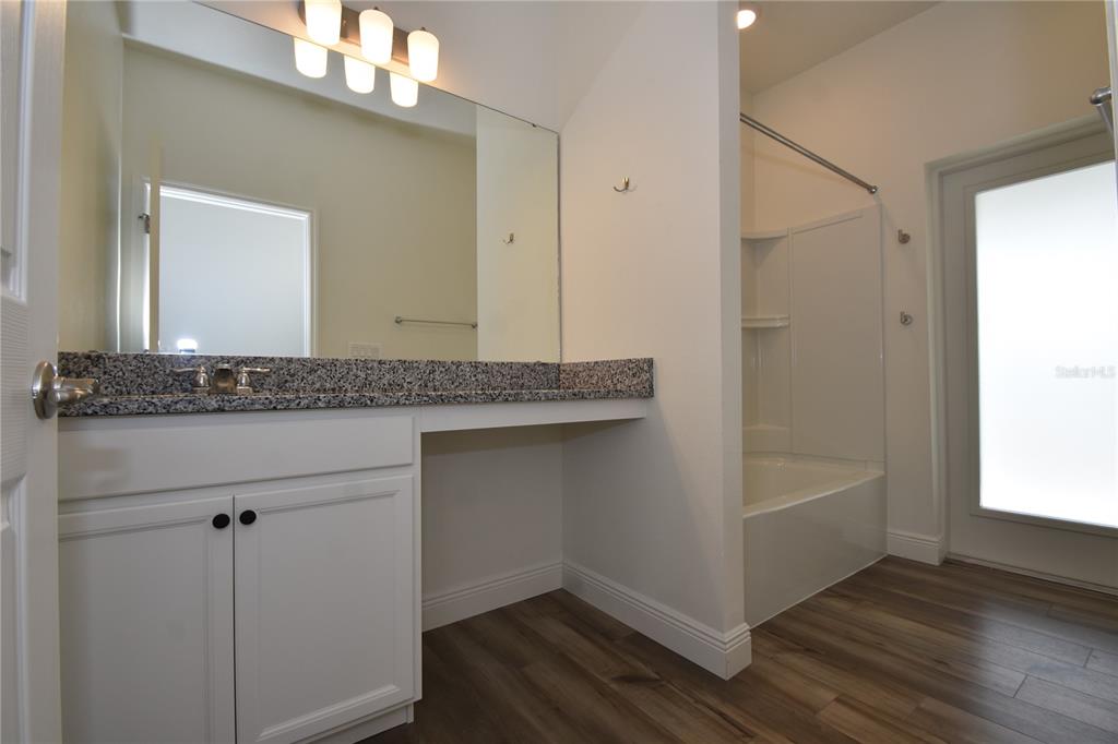 59 Oakleaf Way Palm Coast, FL 32137 - Photo 34 of 39 a bathroom with a granite countertop sink and mirror