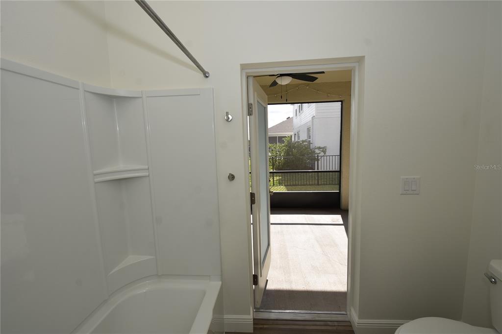 59 Oakleaf Way Palm Coast, FL 32137 - Photo 36 of 39 a bathroom with a glass door shower and toilet