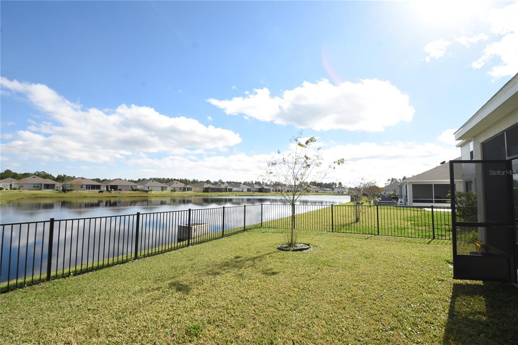 59 Oakleaf Way Palm Coast, FL 32137 - Photo 38 of 39 a view of a lake with a terrace